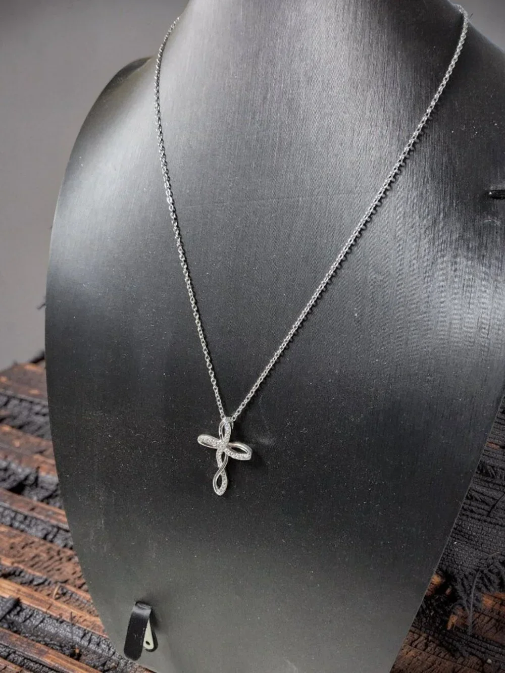 vintage Chrystal lined spiraled curled cross on a .925 sterling necklace